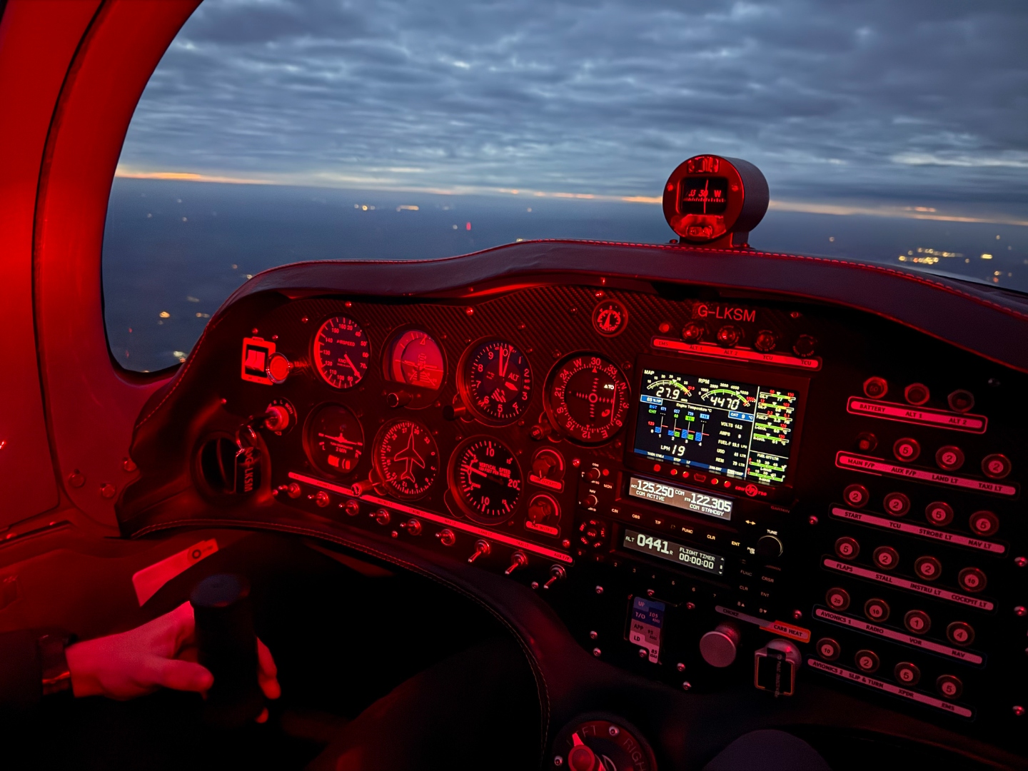 Cockpit view during low-level-style training flight over open countryside